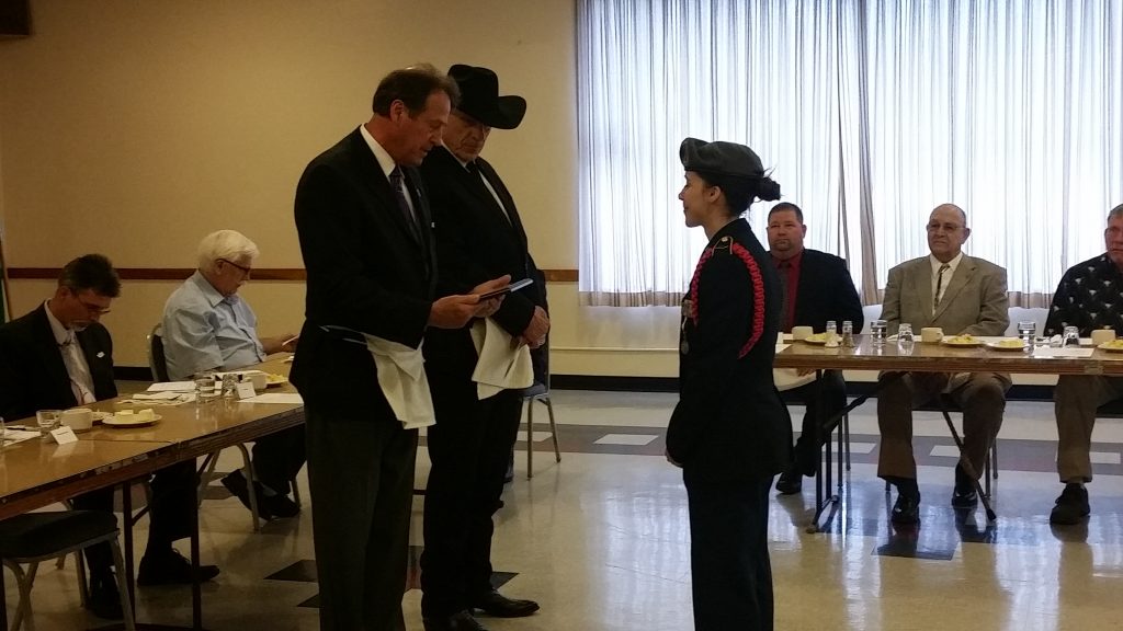 Cadet Mariam Hart receiving awards for service to the community from Right Worshipful Warren Schoeben and Worshipful Master Al Conetto